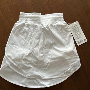 Brand new Lulu lemon tennis sort. White. Size 0 long